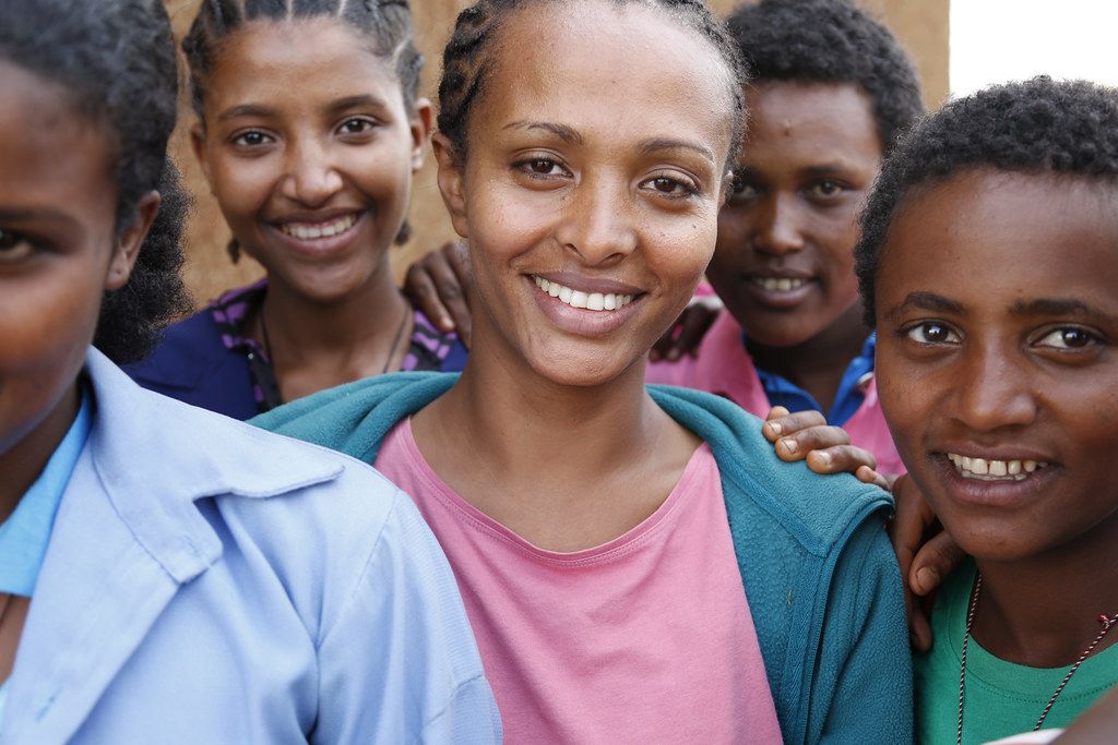 A group of smiling young women in Africa